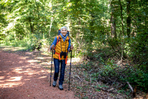 istock Mature senior woman doing nordic walk 1181286049