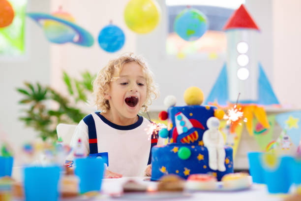 istock Kids space theme birthday party with cake. 1181286288