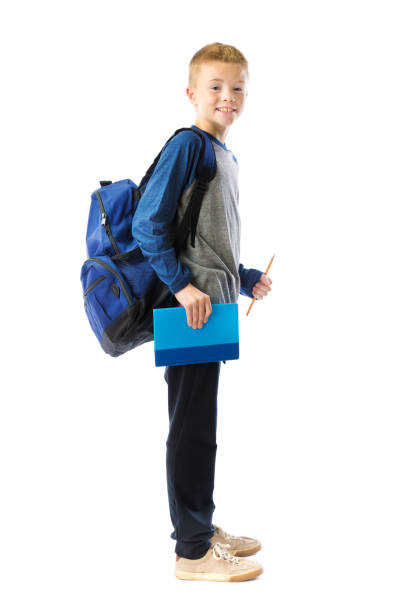 istock Happy Caucasian School Boy on White Background 1181287703