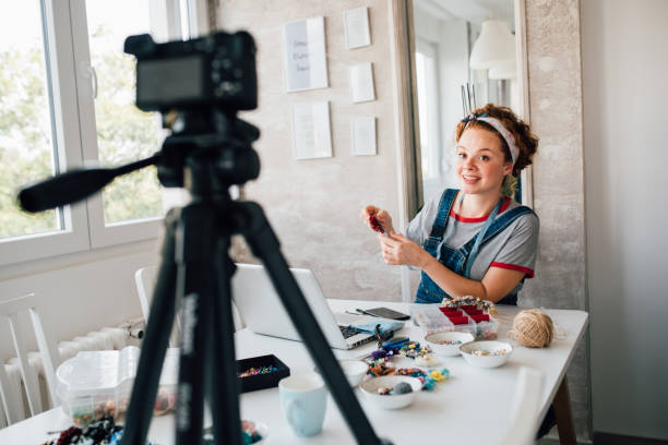istock Young woman making vlog about making jewelry 1181287824