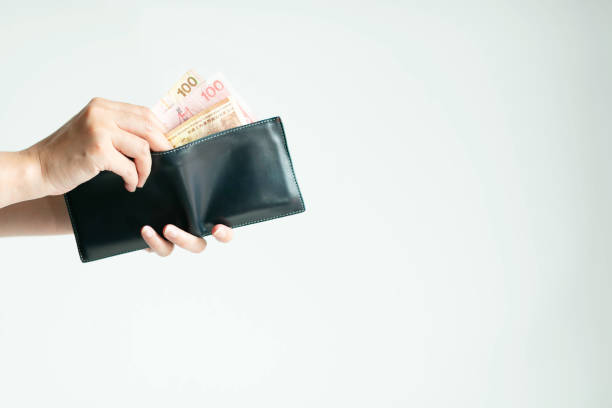istock Hands picking Hong Kong money (Dollar Hong Kong or HKD) from short wallet for payment. 1181288607