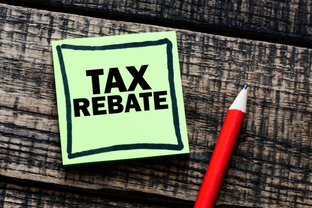 istock Tax rebate text written in a sticky note. View from above 1181293563