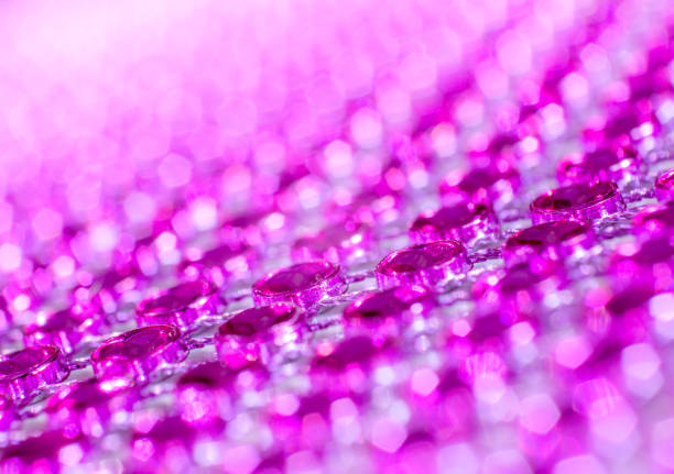 Pretty pink sequin background, up close, macrophotography abstract background