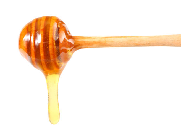 istock honey dripping isolated on a white background 1181296570