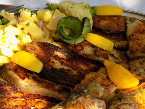 istock Grilled catfish, carp and perch, served with vegetables 1181297599