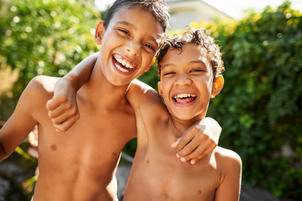 istock Little boy enjoying a day by outdoor pool 1181299467