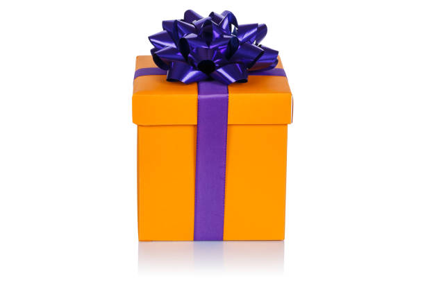 istock Christmas present birthday gift orange box ribbon isolated on white 1181299479