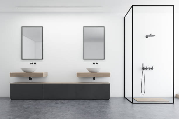 istock White bathroom interior, sink and shower 1181303176