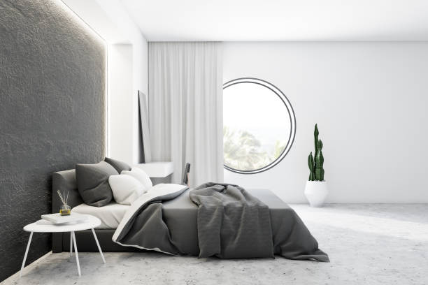 istock Side view of gray and white master bedroom 1181303251