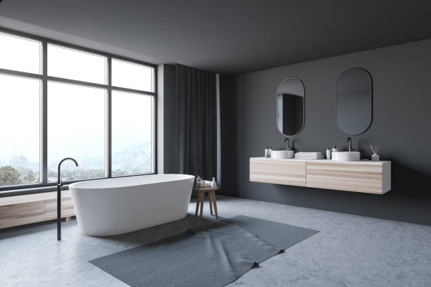 istock Dark gray bathroom corner, tub and sink 1181303365
