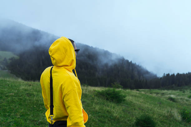 istock Yellow Sweater nature relax man 1181309967