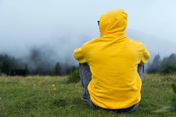 istock Yellow Sweater nature relax man 1181309969
