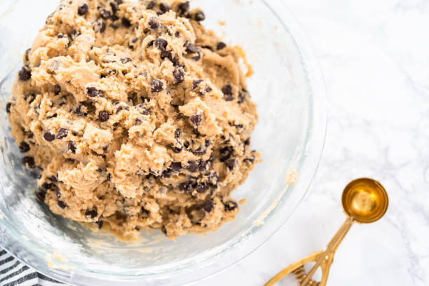 istock Mixing ingredients to bake chocolate chip cookies. 1181311995