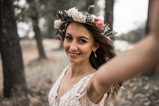 Beautiful bride in wedding dress, selfie time