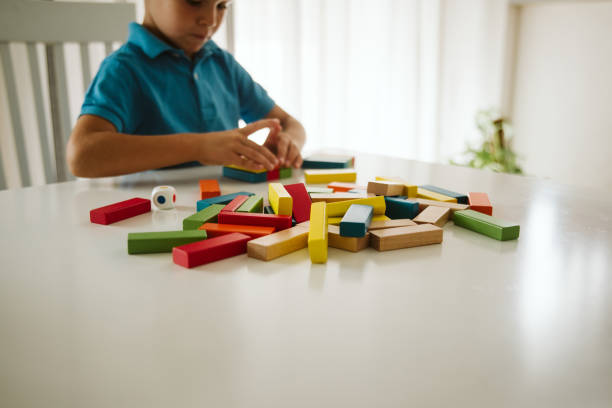 istock Boy is playing with toys at home. 1181314335