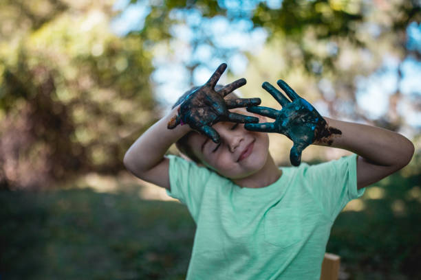 Little boy and his painted hands