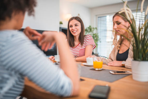 istock Young women having coffee at home 1181315304