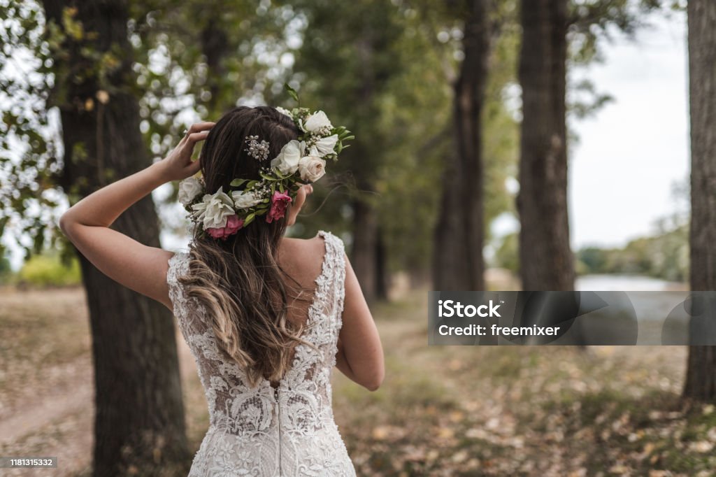 Beautiful bride in wedding dress with floral crown Floral Crown Stock Photo