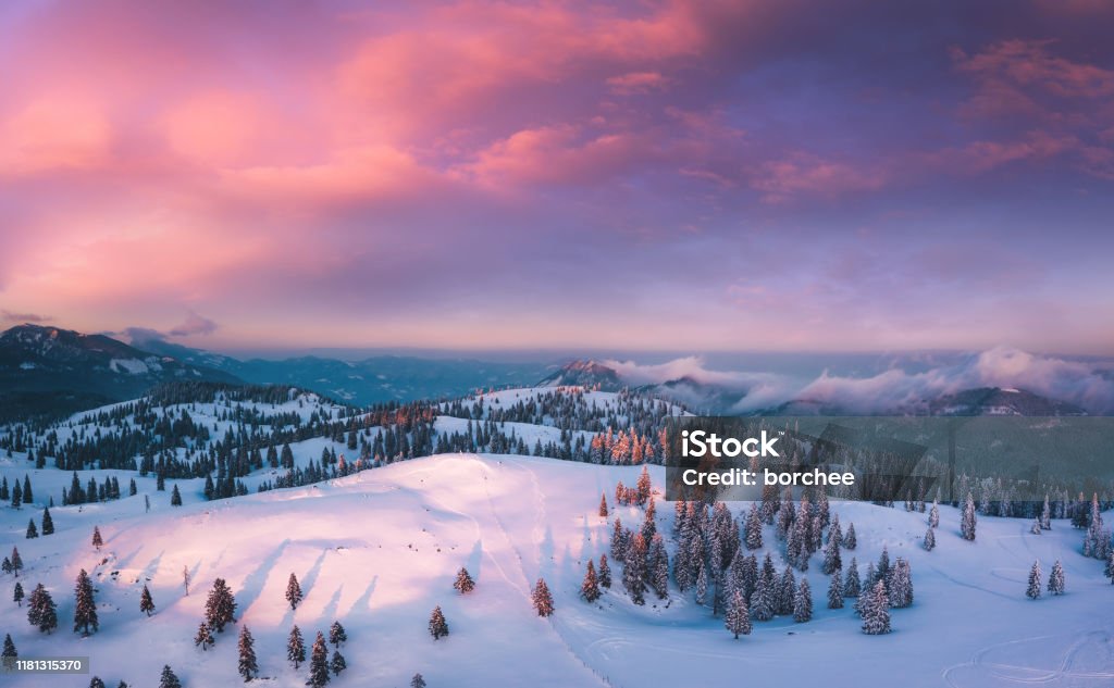Colorful Sunset Idyllic winter landscape at sunset. View from above. Winter Stock Photo