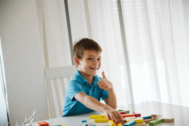 istock Boy is playing with toys at home. 1181315563