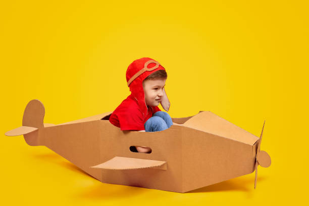 istock Funny boy piloting toy plane 1181317071
