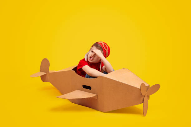 istock Little pilot in plane looking away 1181317080