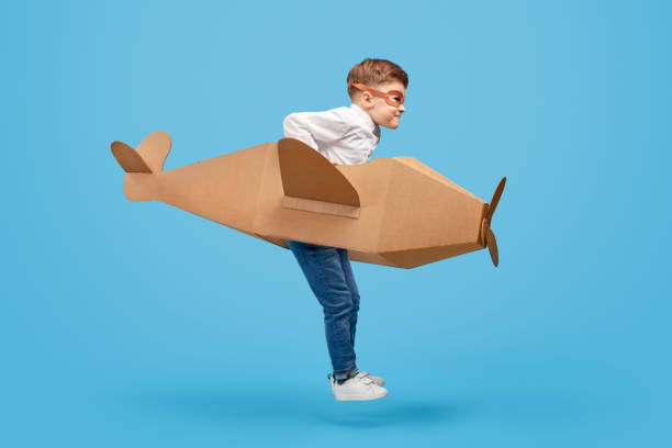 istock Little pilot in carton airplane 1181317083