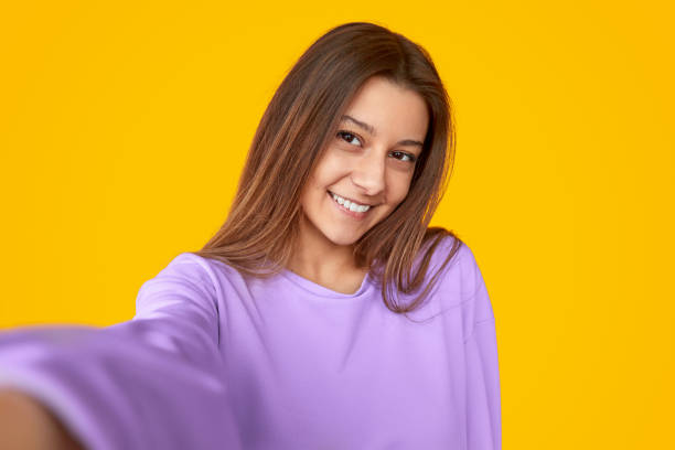 istock Delighted stylish female taking selfie 1181317173