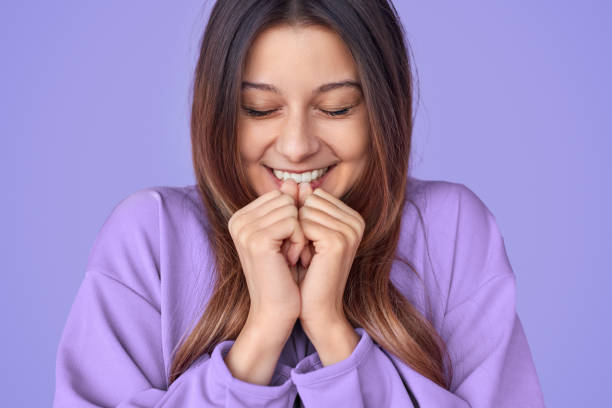 istock Smiling young woman making wish 1181317189