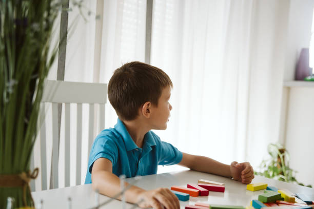 istock Boy is playing with toys at home. 1181317288
