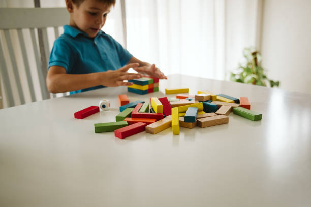 istock Boy is playing with toys at home. 1181317443