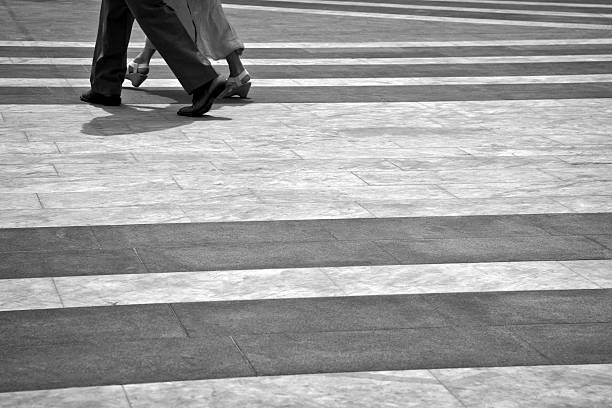 istock Heterosexual Couple Walking in a Town Square, black and White 118131776
