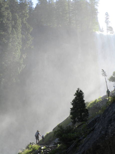 Mist Trail Yosemite National Park Yosemite National Park, CA - ‎July ‎24, ‎2019, ‏‎9:10:58 AM: Visitors to Yosemite National Park in California, young and old, hike up the steep "Mist Trail" leading to Vernal Falls. mariposa county stock pictures, royalty-free photos & images