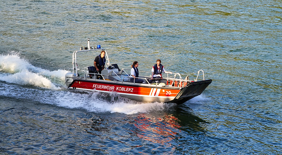 Koblenz, Germany, 08/10/2019: Fire brigade rescue boat during a patrol trip on the Rhine river in Koblenz