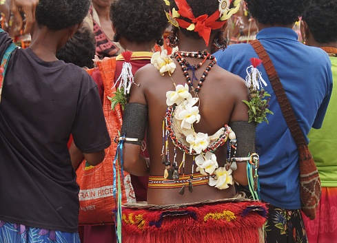 Kiriwina Island, Milne Bay Province, Papua New Guinea, October 2, 2019.
Traditional costumes include an elaborate headdress, grass skirt, flowers, beads and shells