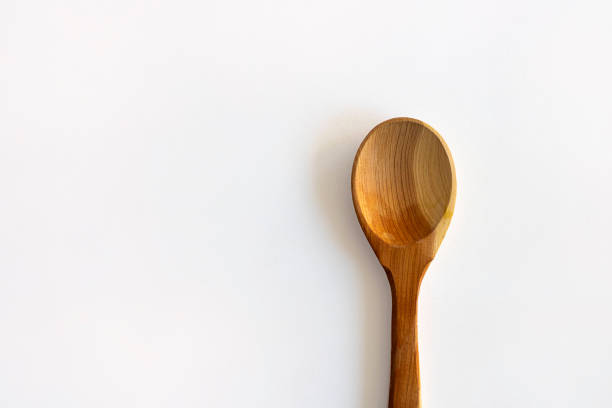 istock Wooden empty spoon on white background, Horizontal with copy space for text and design. Kitchenware, Isolate 1181331439