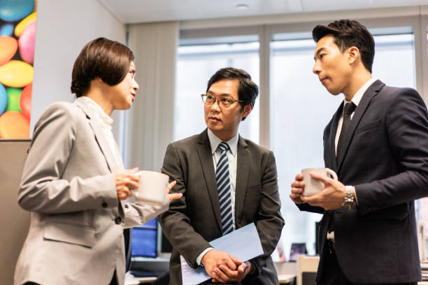istock Asian business people having a discussion in office 1181336332