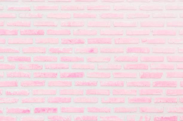 istock Abstract Pastel Pink and White brick wall texture background pre wedding. Brickwork or stonework lovely flooring interior rock old pattern clean concrete grid uneven bricks. 1181337433