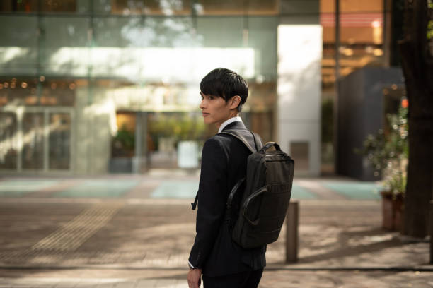 istock Young businessman commuting in financial district 1181338394