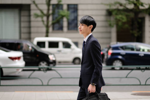istock Young businessman commuting in financial district 1181338459