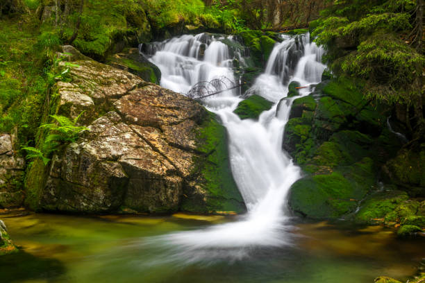 istock Heart-shaped waterfall in the deep of jungle. 1181341283