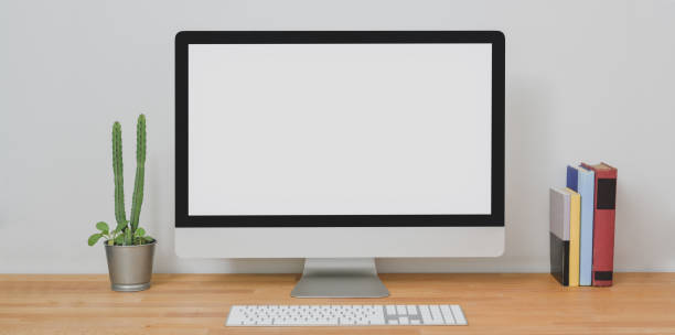 istock Mock up desktop computer in modern home-office room with office supplies 1181343118