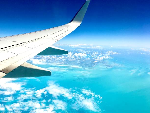 istock Plane wing on Caribbean Sea background . 1181346536