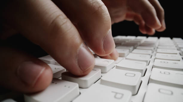 istock Close-up soft-focus finger typing on keyboard. 1181346639