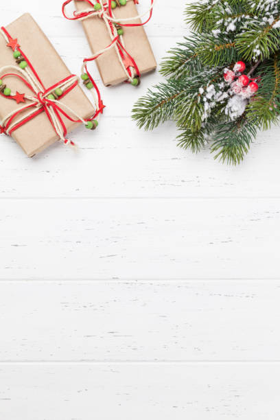 istock Christmas card with gift boxes and fir tree branch 1181347475