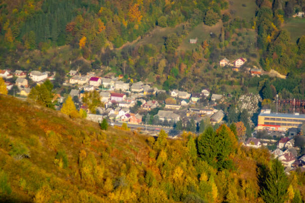 istock A small town among the mountains in autumn, top view 1181353654