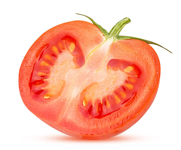 istock Fresh red tomato cut in half with green leaves 1181359915