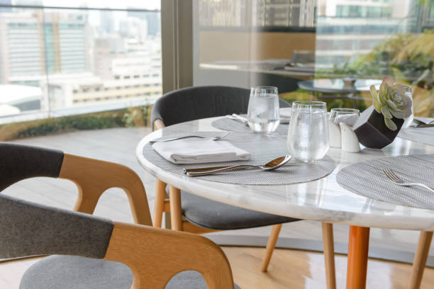 istock Tableware setting in the restaurant. Decorated elegant table, glasses, napkin, knife, fork and spoon 1181363969