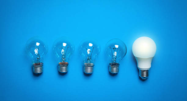 istock Light bulbs in the blue background. 1181367742
