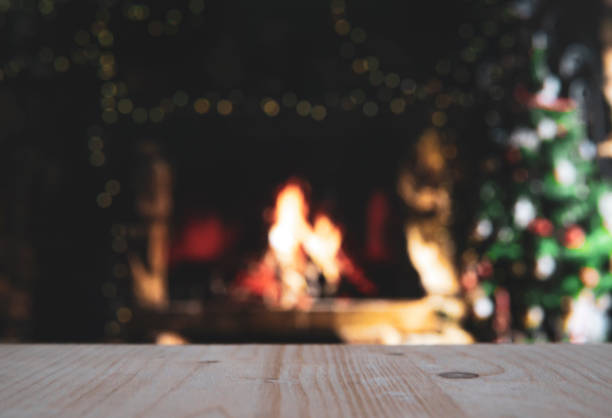 istock Wooden table with blurred christmas background 1181367765